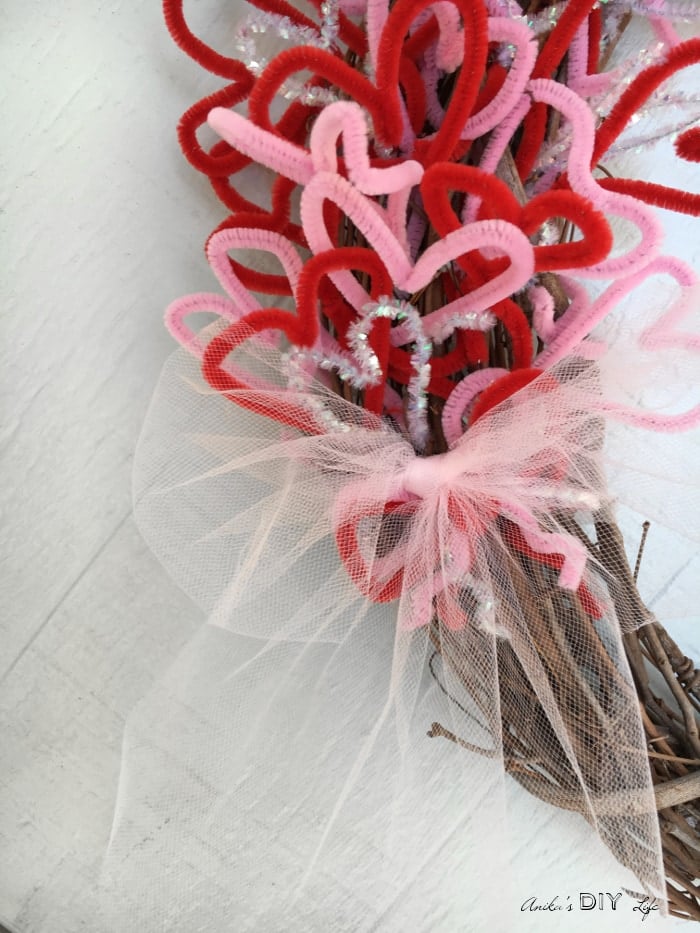 Finish a pretty and easy Valentine's wreath with a pretty bow