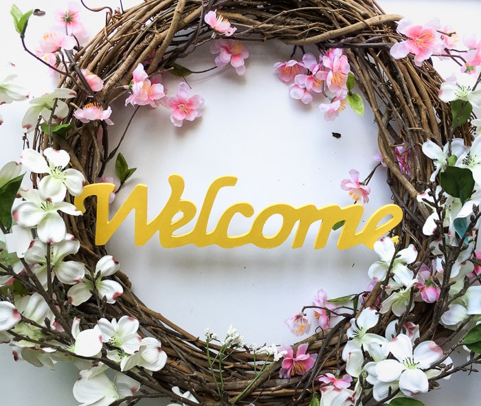 Make an easy and gorgeous DIY Spring wreath for under $15. Reuse a grapevine wreath for every season! 