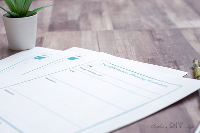 Close up DIY project planning worksheet on brown table