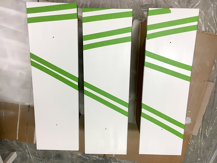 Ikea Tarva dresser drawers with masking tape across to paint stripes 