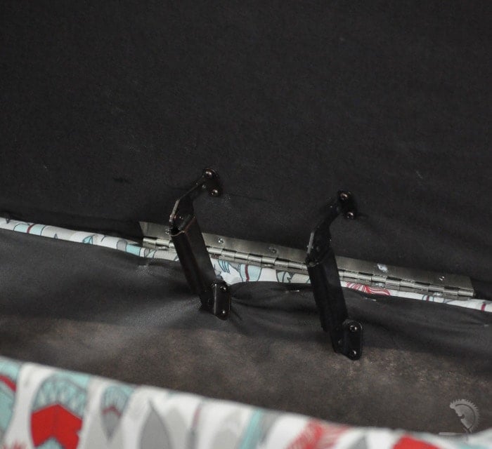 close up of hinge and toy box lid supports