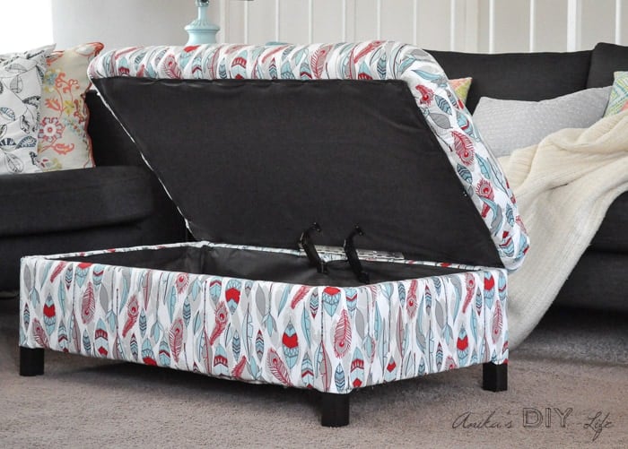 Make your own DIY upholstered storage ottoman starting with lumber from the store - it is super easy! This tutorial covers everything!