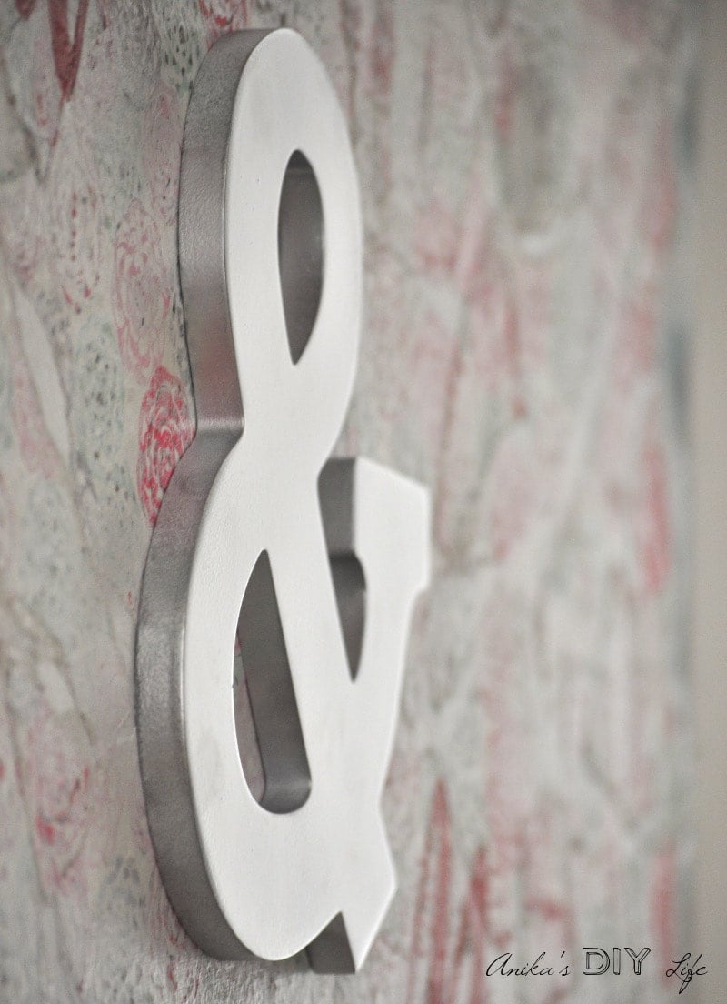 An easy DIY Wall art perfect for the bedroom! Layers of paint and pretty wrapping paper distressed for the most amazing effect. 