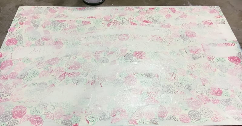 Decoupage pretty wrapping paper over layers of paint for a fun effect