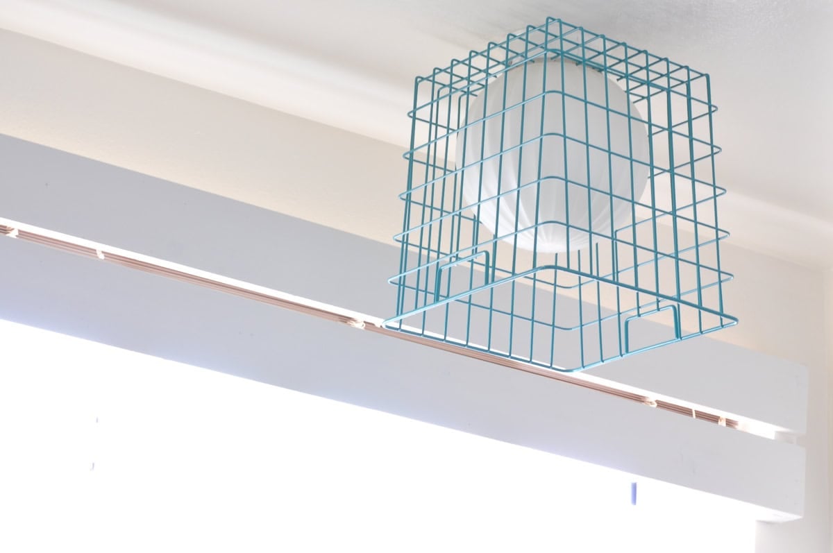blue wire backet on top of light