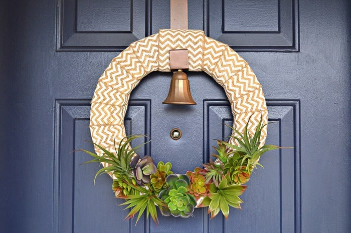 burlap wreath with fauz succulents on blue door