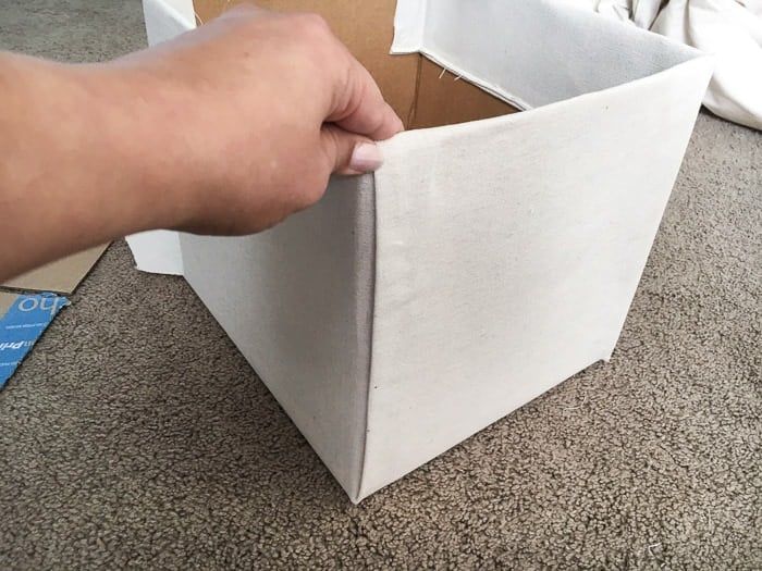 How to make perfect no-sew canvas storage bins by wrapping cardboard boxes in drop cloth. This is a fun easy drop cloth organization project