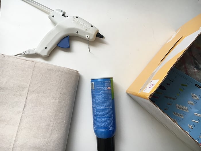 How to make perfect no-sew canvas storage bins by wrapping cardboard boxes in drop cloth. This is a fun easy drop cloth organization project