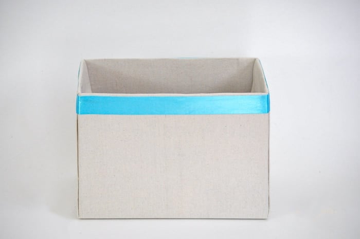 How to make perfect no-sew canvas storage bins by wrapping cardboard boxes in drop cloth. This is a fun easy drop cloth organization project
