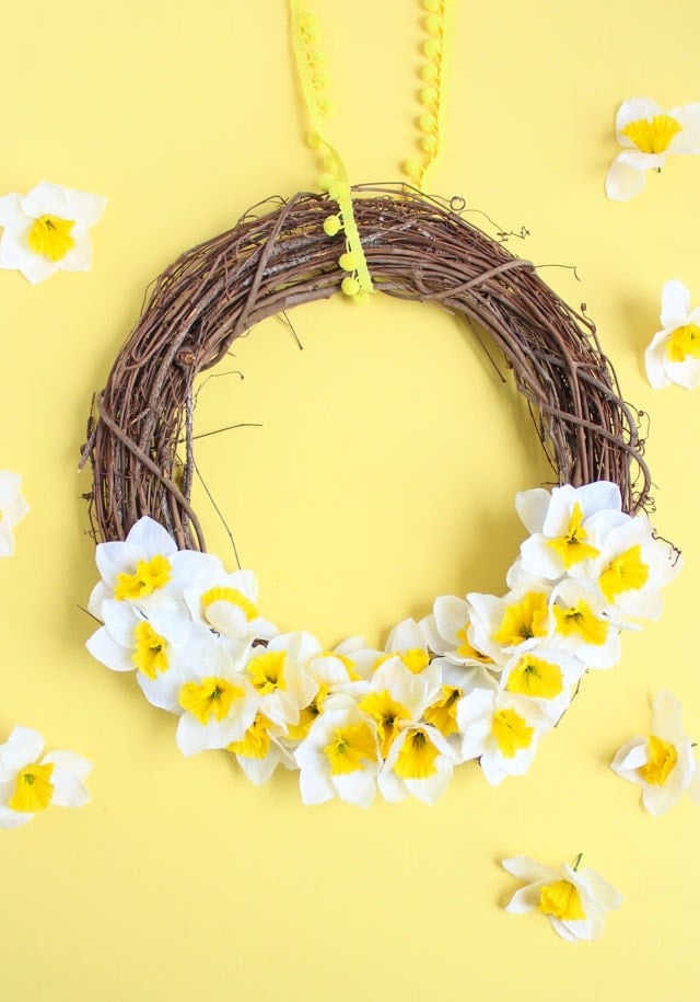grapevine wreath with white and yellow flowers