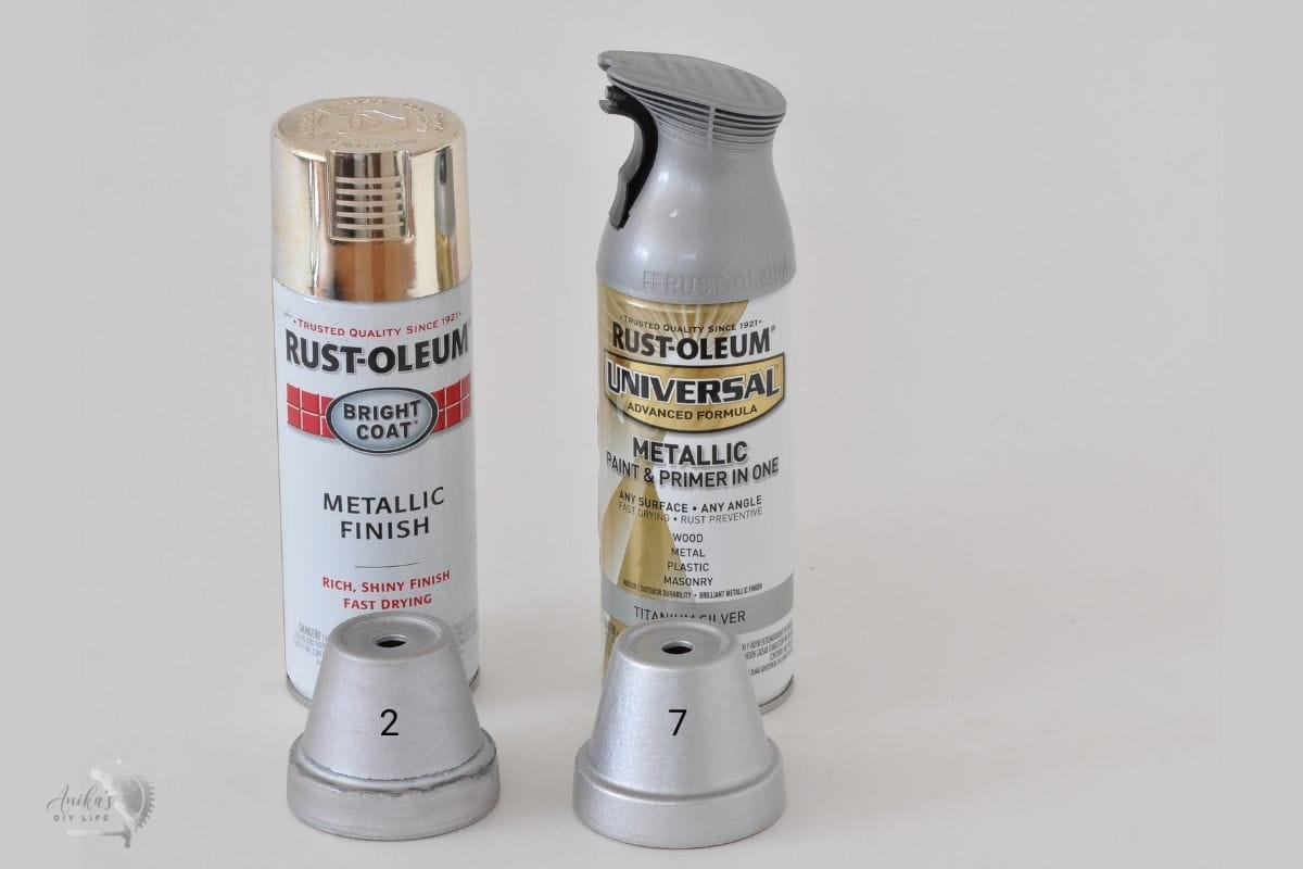2 silver spray paint cans with silver plant pots in front of them labeled 2 and 7