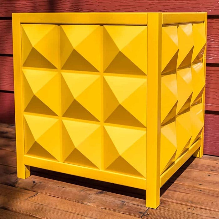 yellow planter box with paneled sides