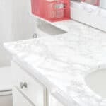 Is marble contact paper durable in bathrooms? See my 1-year countertop review. Plus how to remove it damage-free.