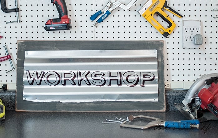 This custom industrial sign is so easy and quick to make! Add lots of character with this easily personalized rustic metal sign to your workshop or home!