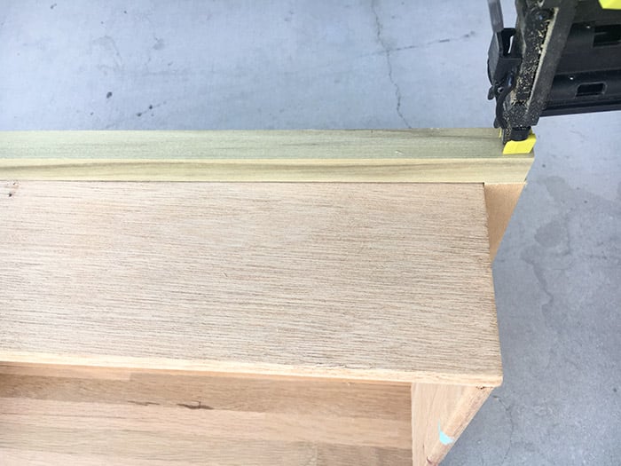 attacching dowels to drawers in order to repurpose them to a DIY Bar cart