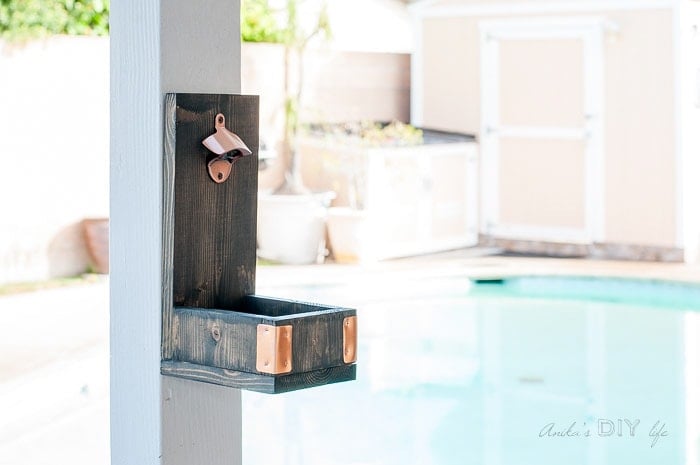 DIY wall mounted bottle opener on wall.