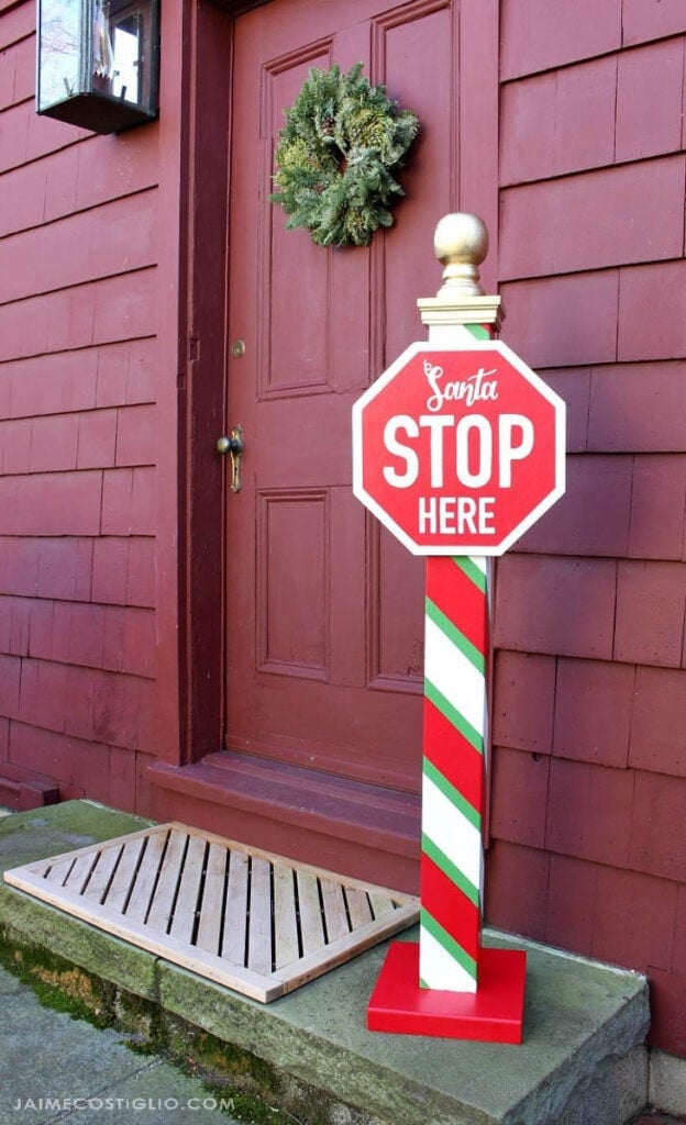 Santa Stop Here Pole with candy cane strips on pole