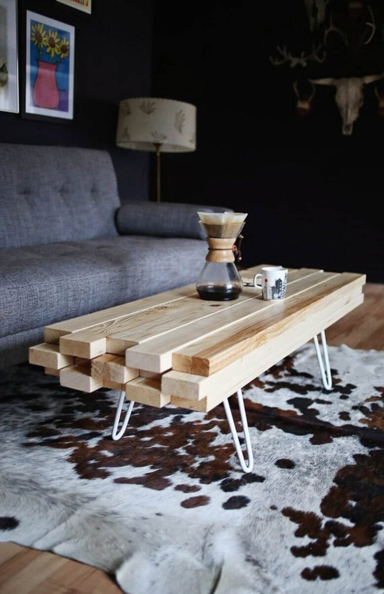 Coffee table made by stacking 2X4 boards on top of each other.