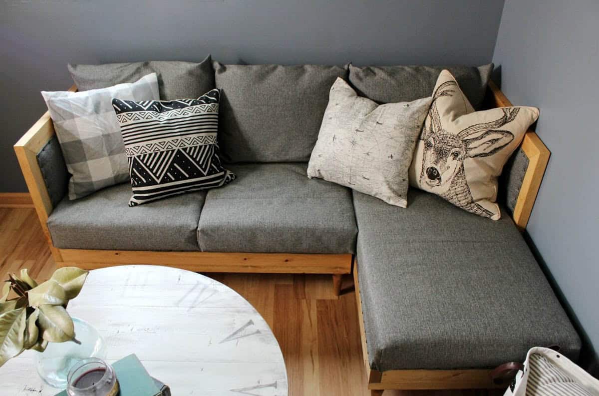 Upholstered couch with chaise made with 2X4s in a small living space