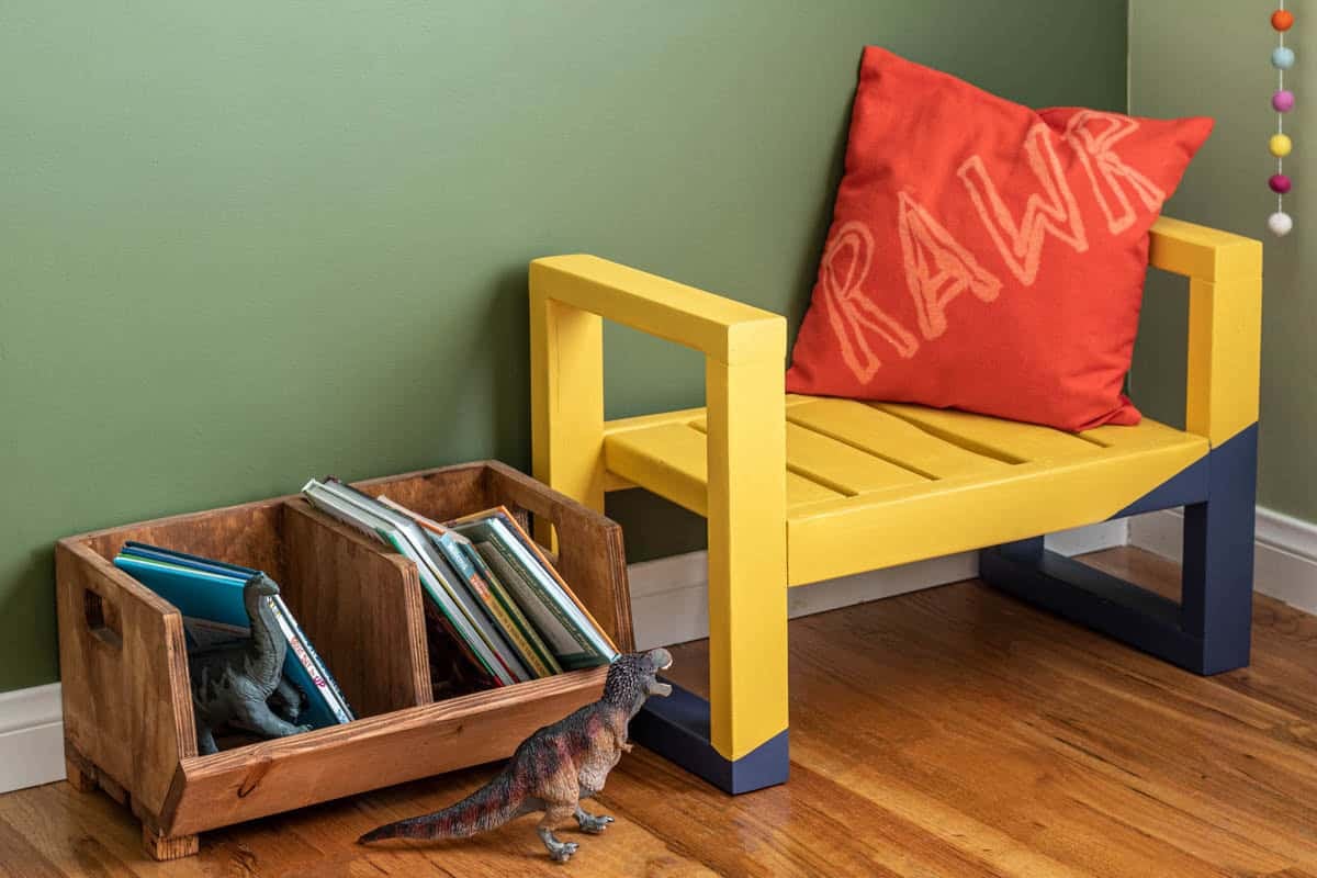 yellow and blue painted toddler bench made with 2X4s