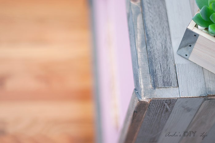 close up of other corner of DIY rustic modern barn wood bookshlef