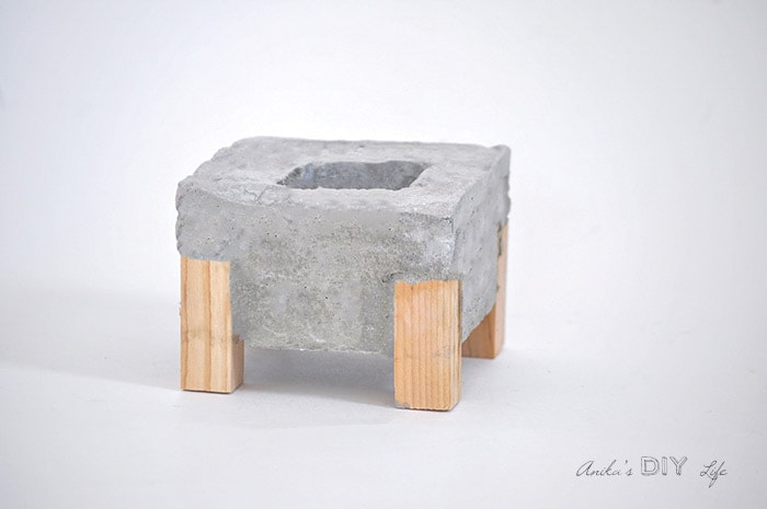 completed concrete planter with wood feet