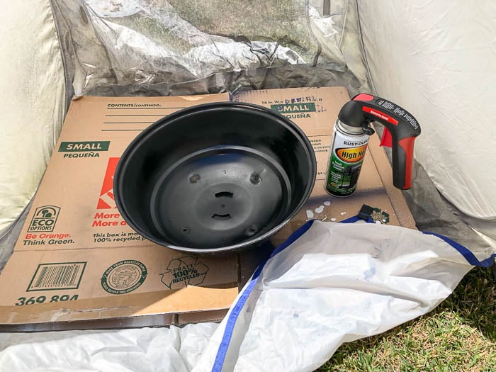 Spray painting an old charcoal grill
