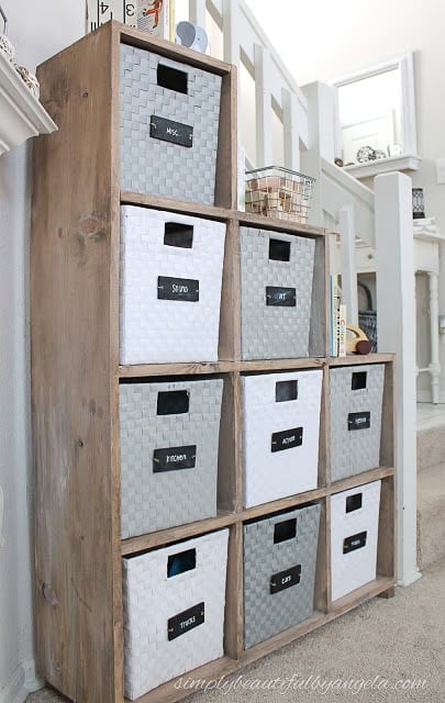 wooden toy shelf with bins