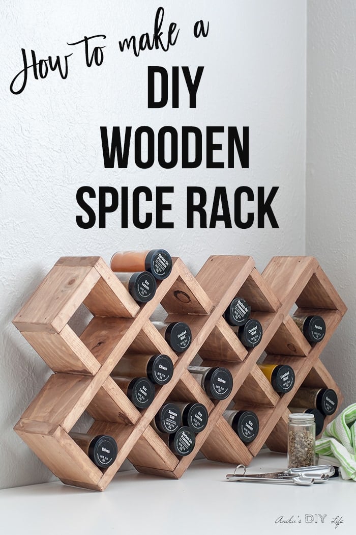 A large collection of multi colored spice jars on wooden shelf