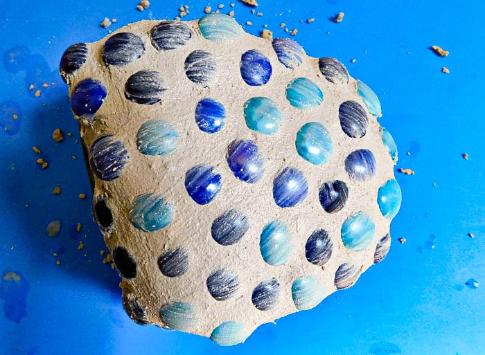 Garden rock covered in gems and grout