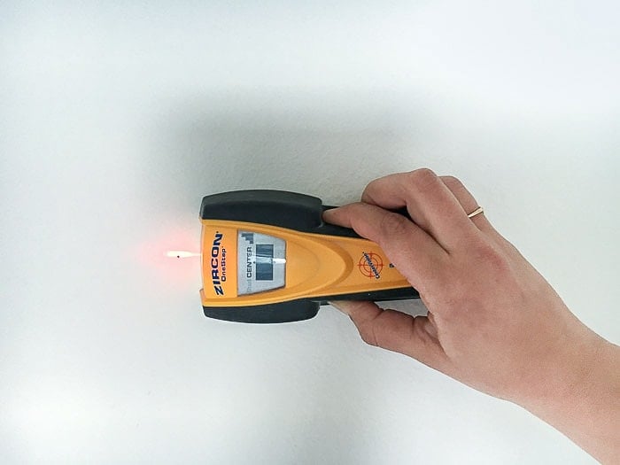 Finding the studs using a stud finder.