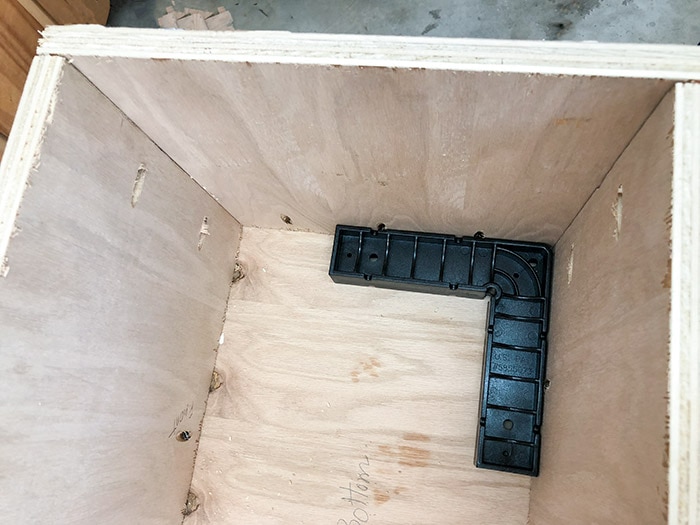 Using an assembly square to make sure sides are square