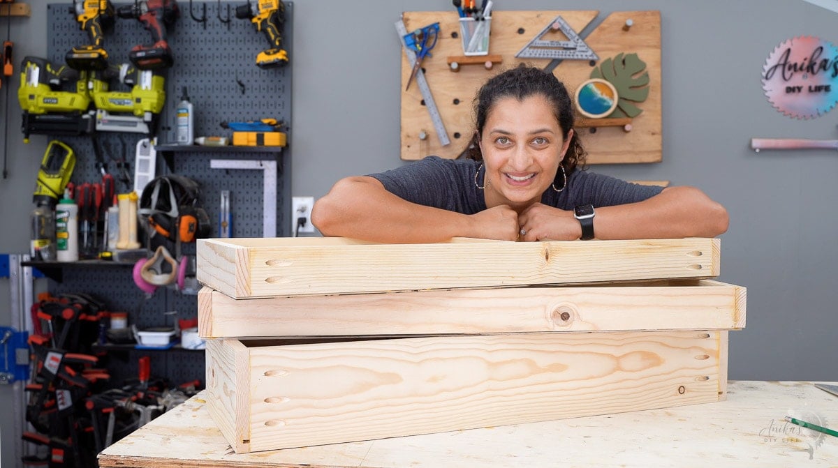 Stack of 3 drawers and a woman