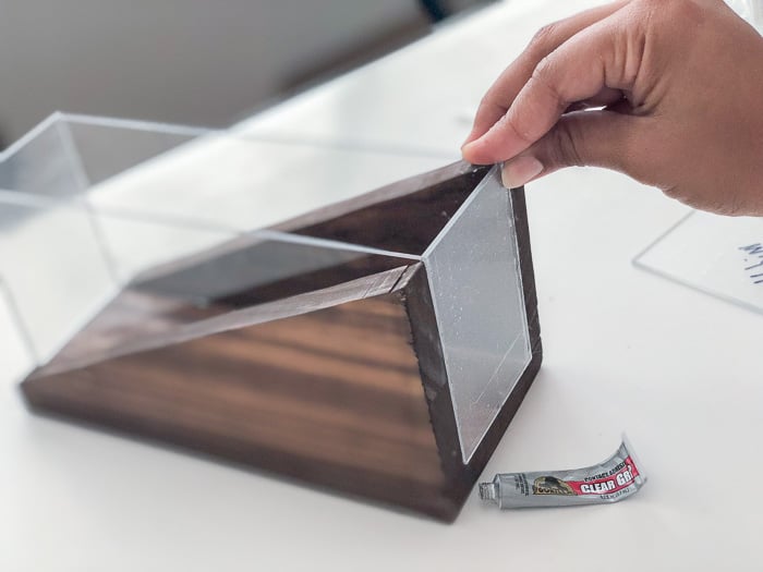 Attaching the plexiglass to the wood base for the modern diy pencil holder