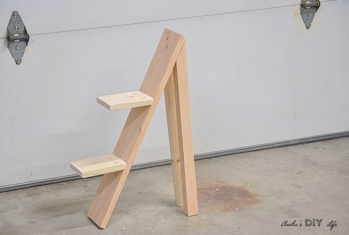 COmpleted DIY tiered plant stand in workshop