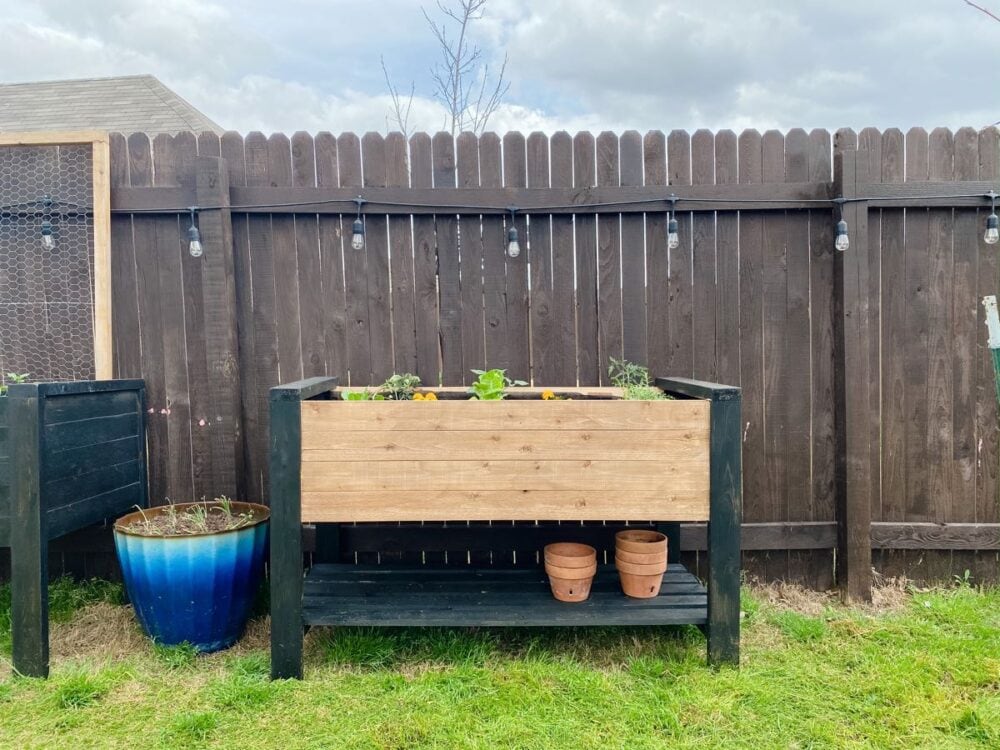 raised wood planter box with storage shelf