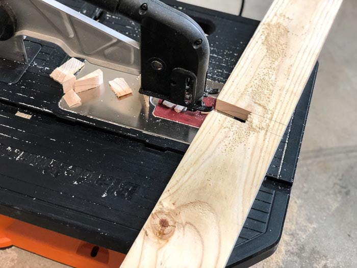 Cutting slits in dividers for the DIY under bed shoe storage using a Blade Runner.