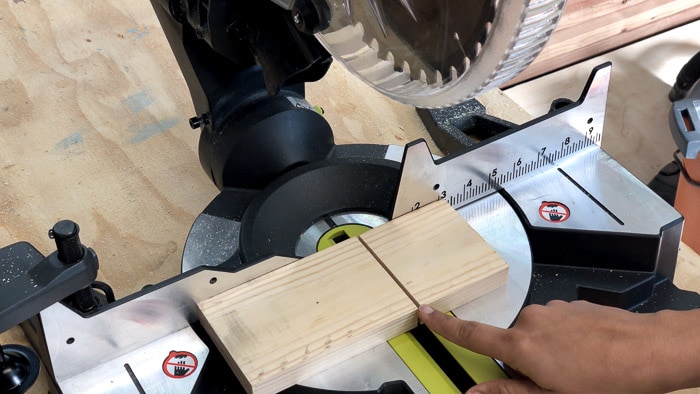 A piece of lumber cut with gap showing the kerf of a blade.