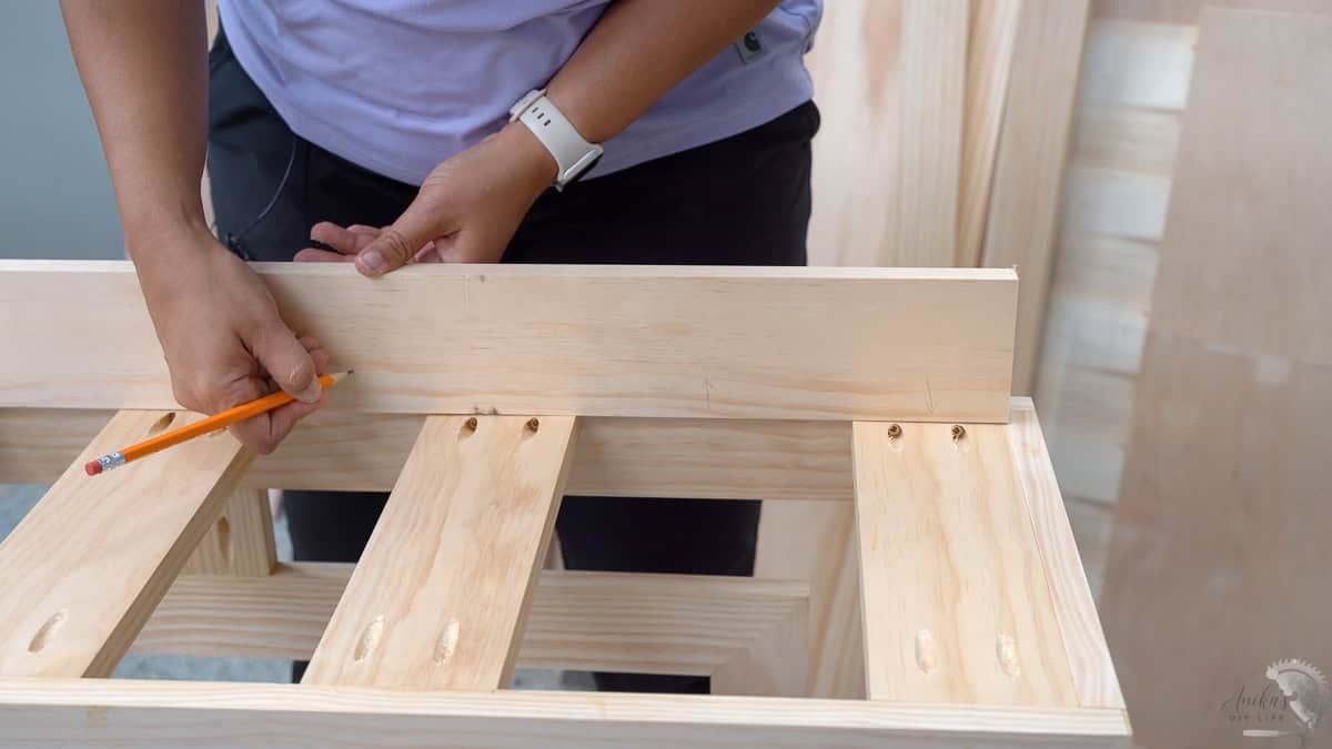 marking the location of the pocket holes in the spacer board