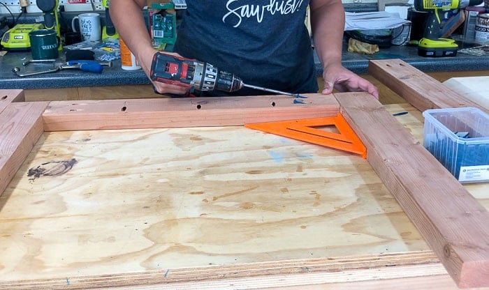 attaching aprons to legs using pocket hole screws for the DIY outdoor dining table