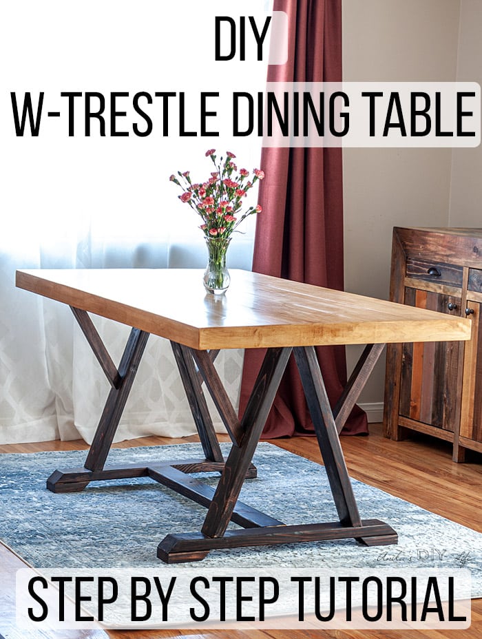 DIY Trestle dining table in dining room with blue rug and red drapes