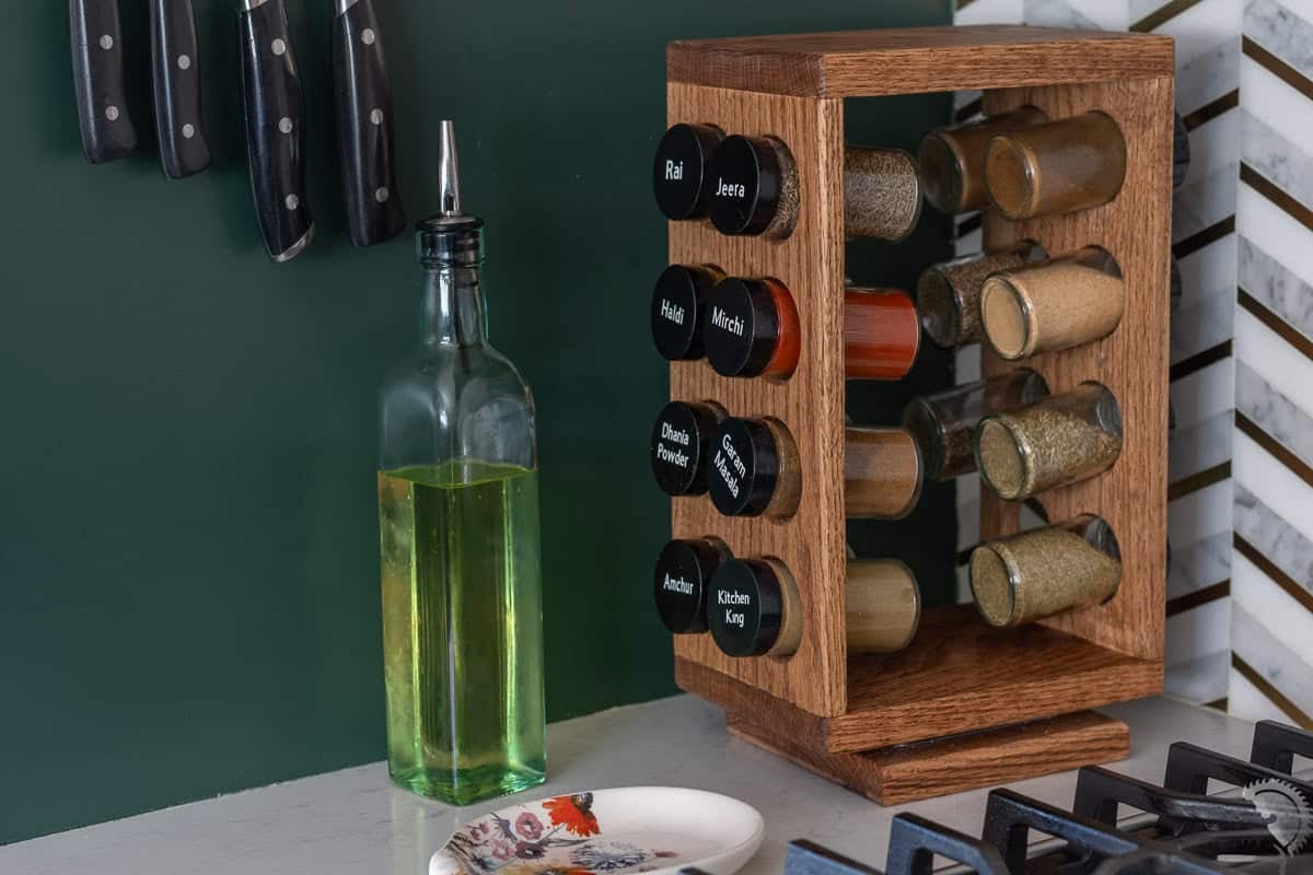 DIY rotating spice rack on kitchen counter with indian spices.