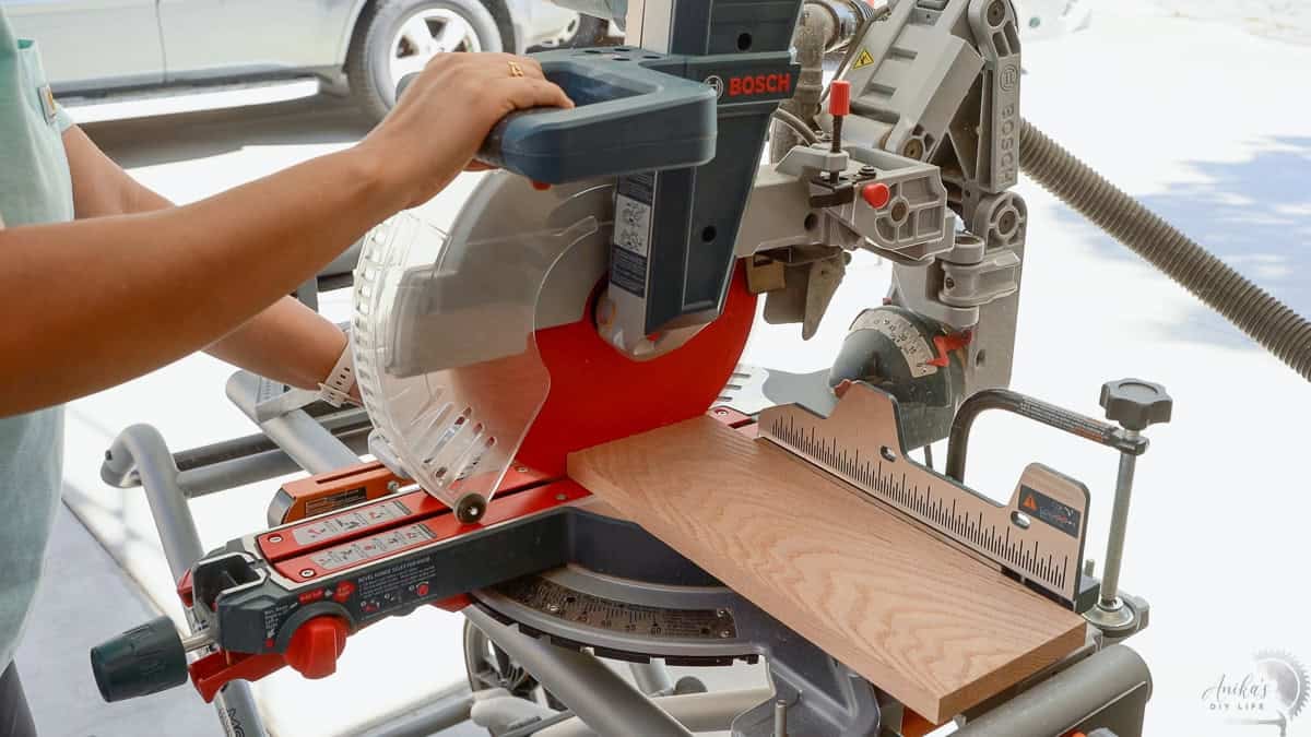 Cutting oak on the miter saw for making the spice rack