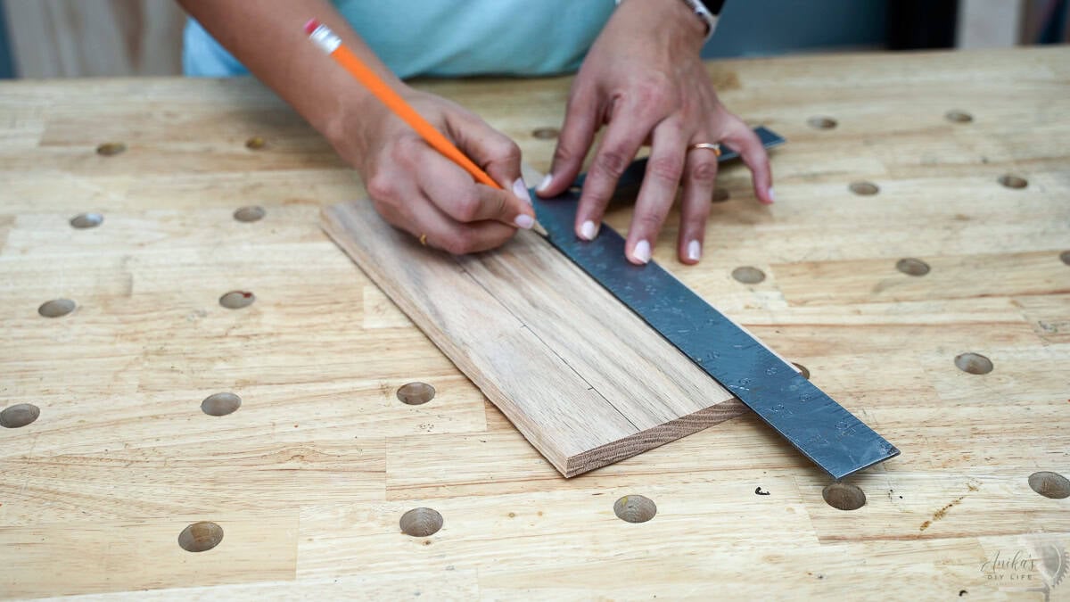Measuring and marking the location for the holes for the spice bottles