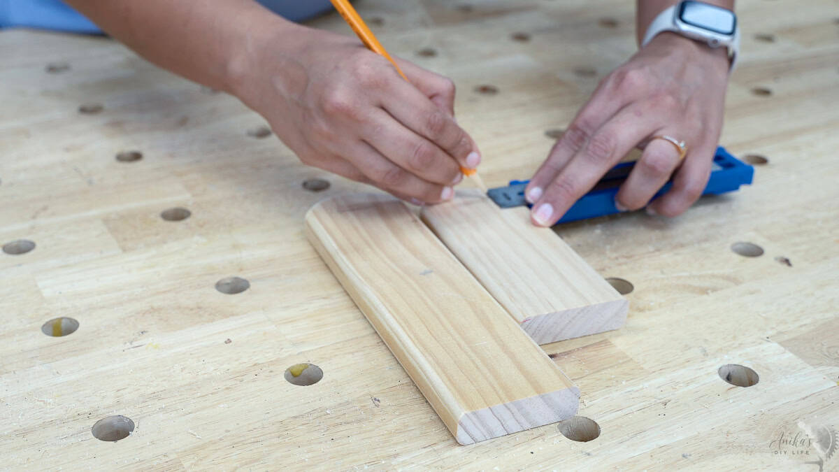 Marking locations for the dowel for the jewelry holder