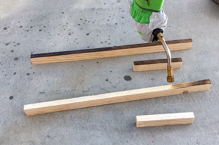 Charring the 1x2trim pieces for the house number sign project