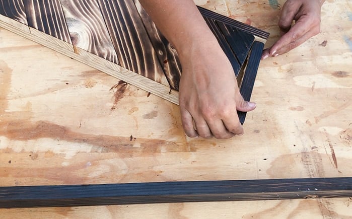 attaching trim to the house number sign
