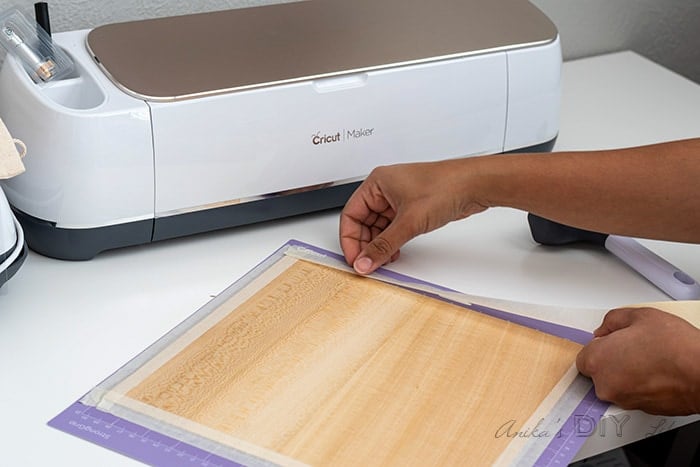 Attaching basswood to Cricut Maker mat to cut