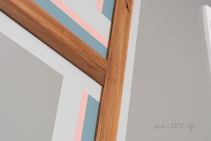 close up look at the accent wall with paint and wood