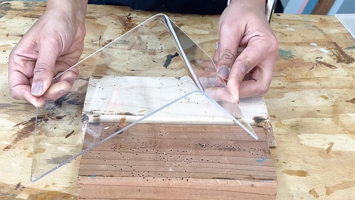 bending the piece of plexiglass